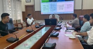 Sonitpur District Commissioner Shri Ananda Kumar Das and TERI officials discussing biodiversity conservation in a meeting room.