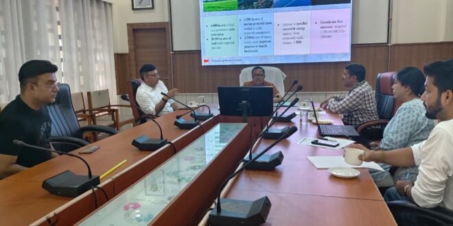Sonitpur District Commissioner Shri Ananda Kumar Das and TERI officials discussing biodiversity conservation in a meeting room.